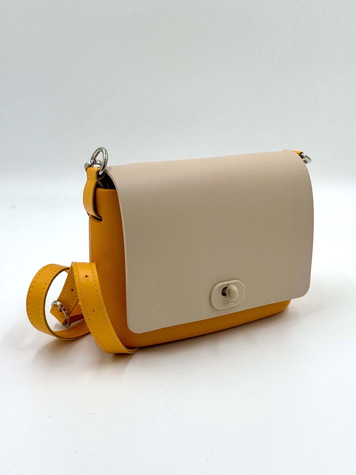 O bag Pocket mini bag – yellow body, off-white lid, twist lock, yellow strap